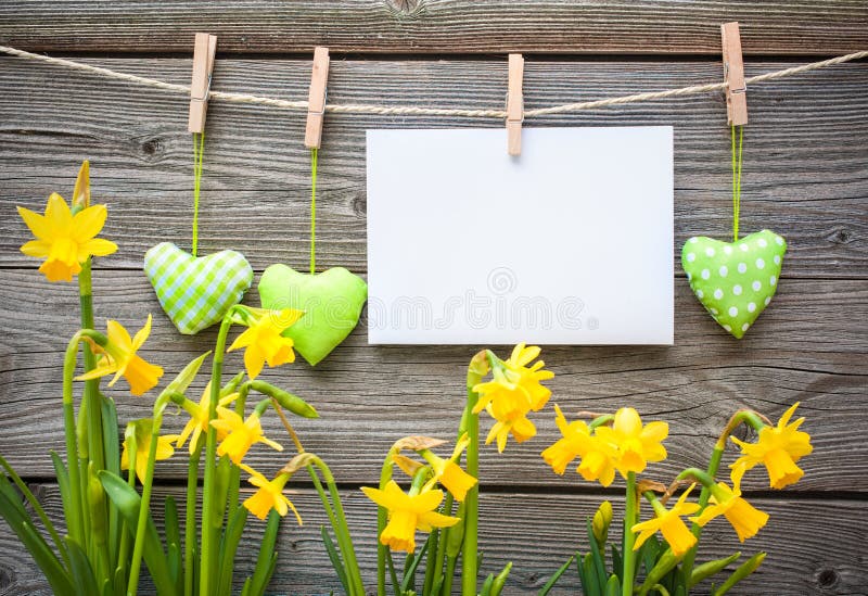 Message and hearts on the clothesline against wooden background