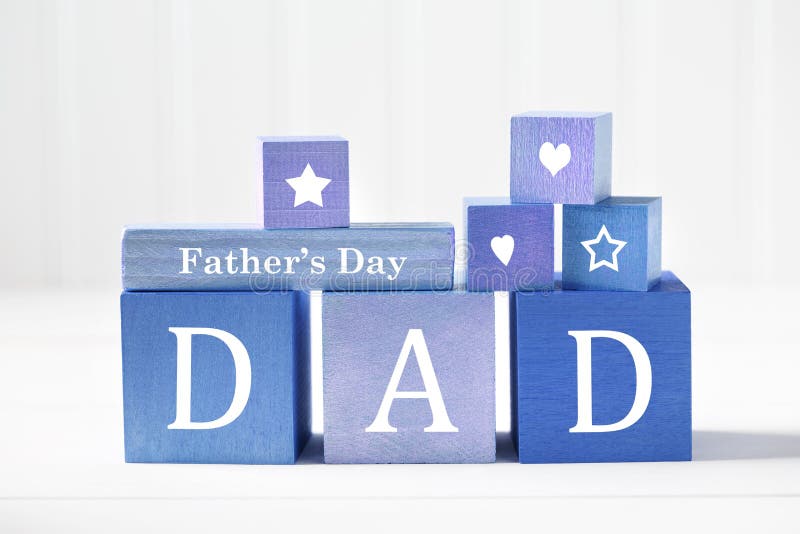 Fathers Day message on colorful blue wooden blocks. Fathers Day message on colorful blue wooden blocks