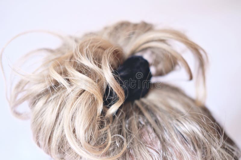 Messy Bun On The Head Of A Blonde Woman. Slightly Curly Hair Stock Photo -  Image Of Head, Color: 177127634