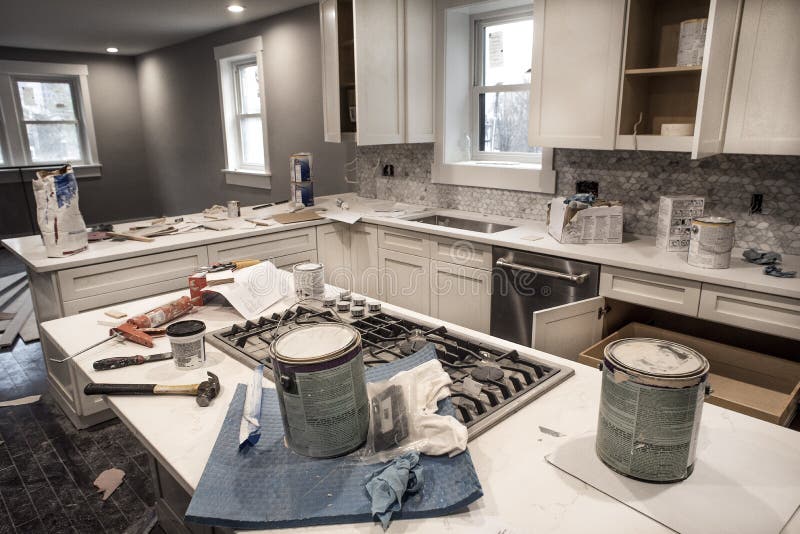 Messy Home Kitchen During Remodeling With Cabinet Doors Open