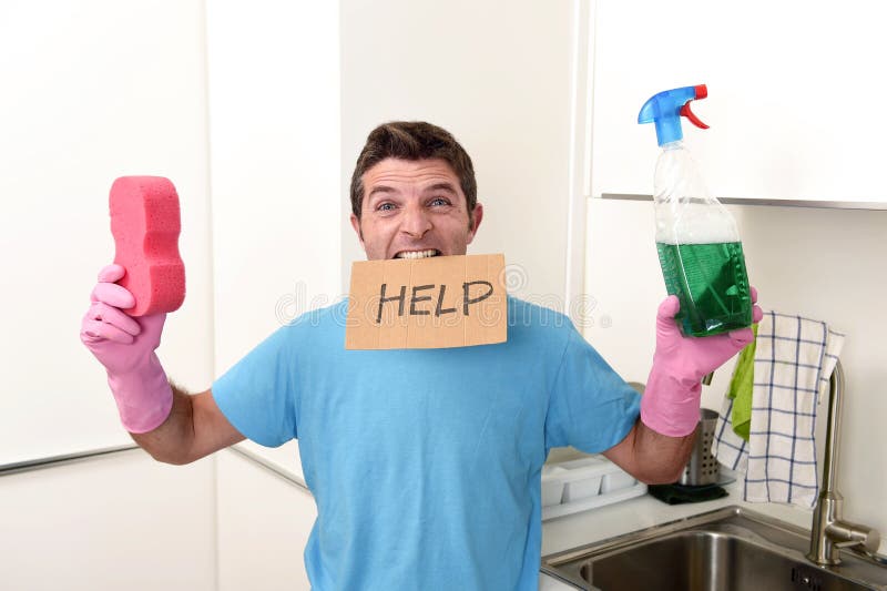 Messy man in stress in washing gloves holding sponge and detergent spray bottle asking for help royalty free stock photos Messy man in stress in washing gloves holding sponge and detergent spray bottle asking for help royalty free stock photos