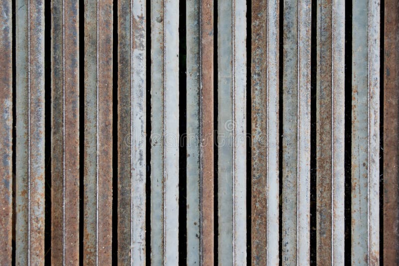 Metalen, inklapbare verticale ijzeren staaf voor textuurachtergrond stock afbeelding