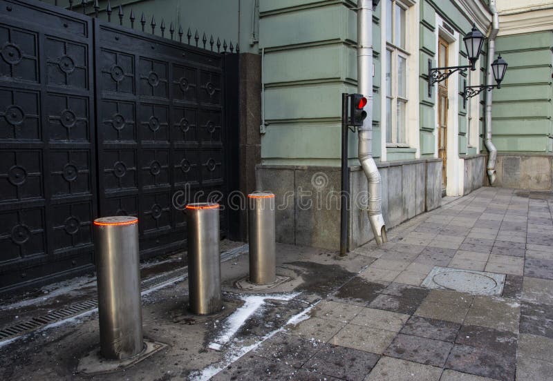 Metal automatic gates with traffic lights and automatic parking posts stock photography Metal automatic gates with traffic lights and automatic parking posts stock photography