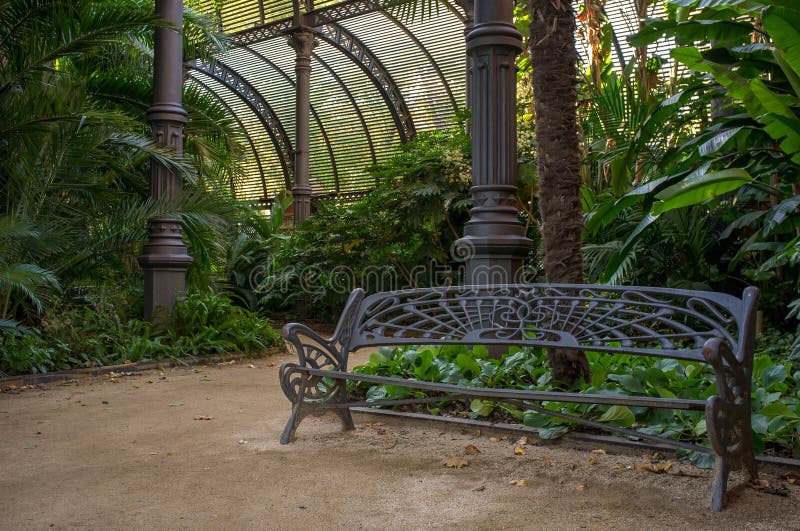 Metal bench in beautiful park, Barcelona. Pillar column garden stock images, royalty-free photos and pictures