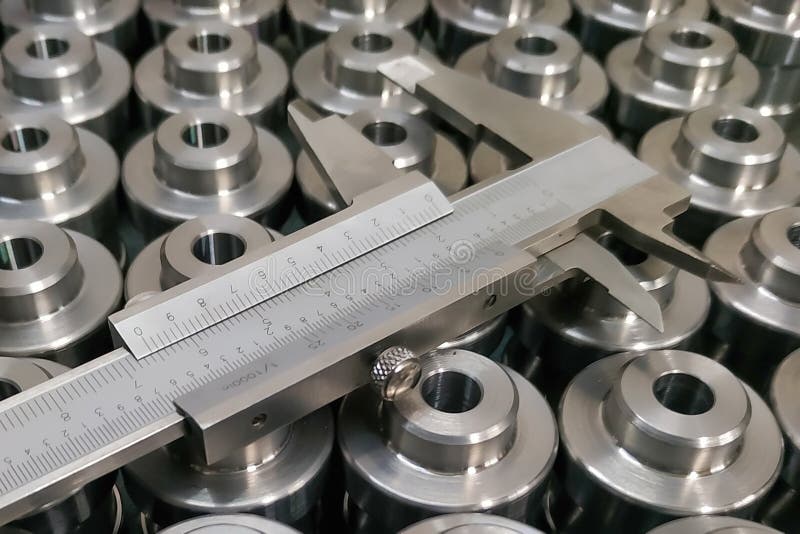 Measurement of metal bushings with a caliper after machining on a lathe. Measurement of metal bushings with a caliper after machining on a lathe