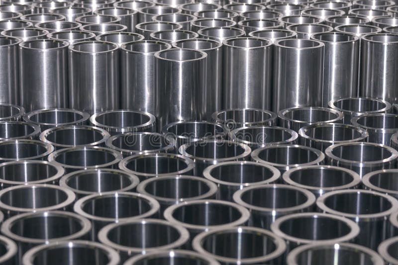 Photograph shows metal bushings prepared for thermal processing. Photograph shows metal bushings prepared for thermal processing