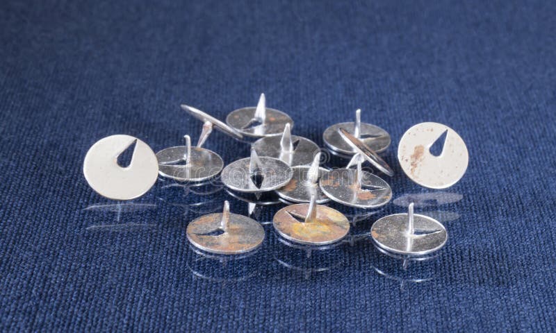 Metal button for attaching the ad to the board stock photography