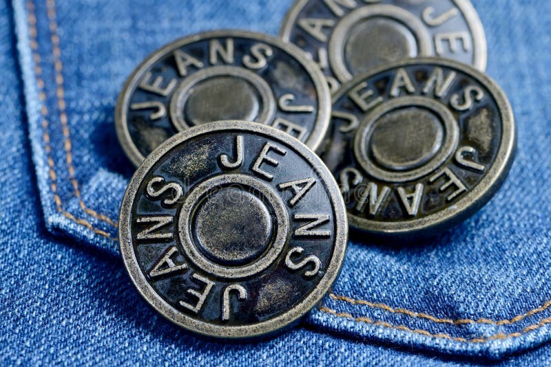 Metal Buttons with Inscription in English Jeans on a Denim Stock Image ...