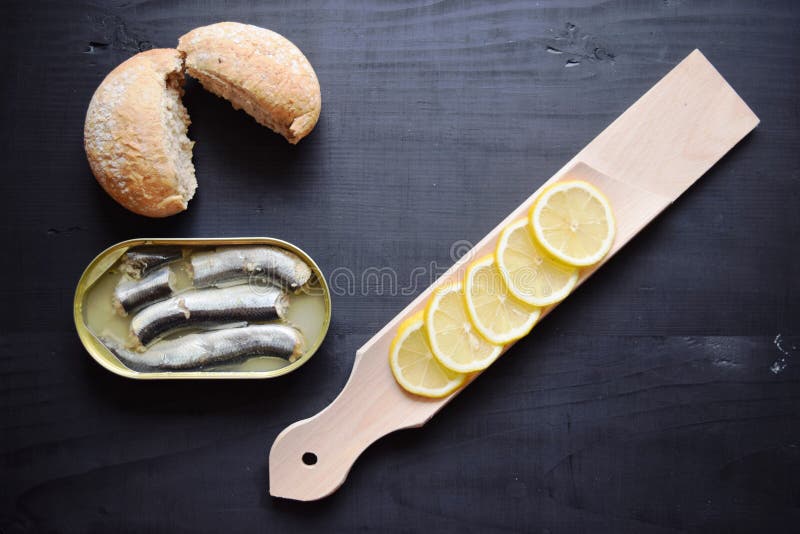 Metal can with conserved herring fish, canned marinated herring, open tin can , Top view. stock image Metal can with conserved herring fish, canned marinated herring, open tin can , Top view. stock image