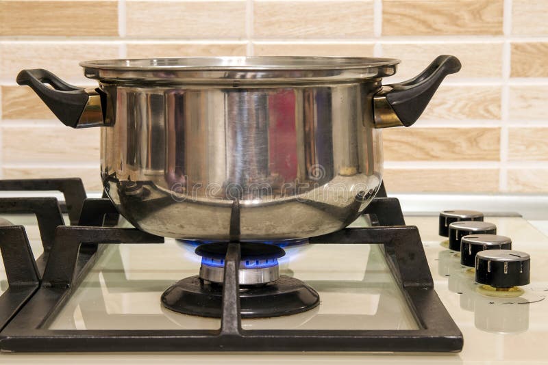 Metal Cooking Pot Standing on Kitchen Stove with Flame. Stock Photo Image of burn, cooking