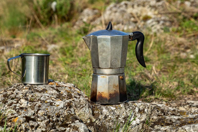 Metal Coffee Maker on an Open Fire in Nature. Making Coffee Stock
