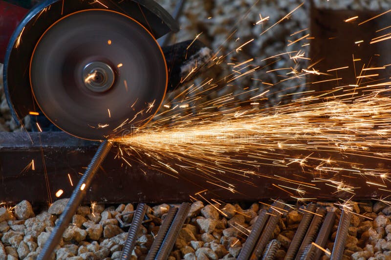 A metal cutting machine is in use stock photos