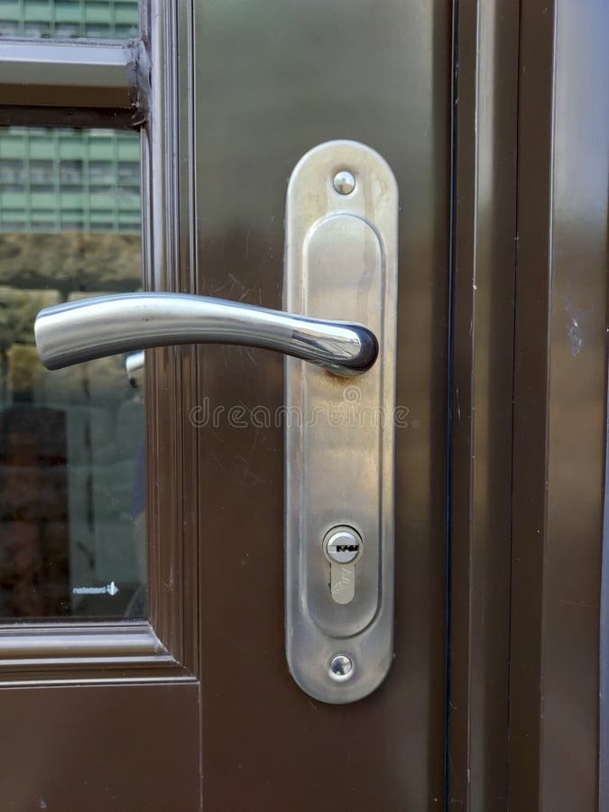 Metal door handle and lock stock photo. Image of column 268159650