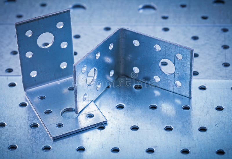 Metal Drilled Angle Bars on Perforated Metallic Stock Image Image of