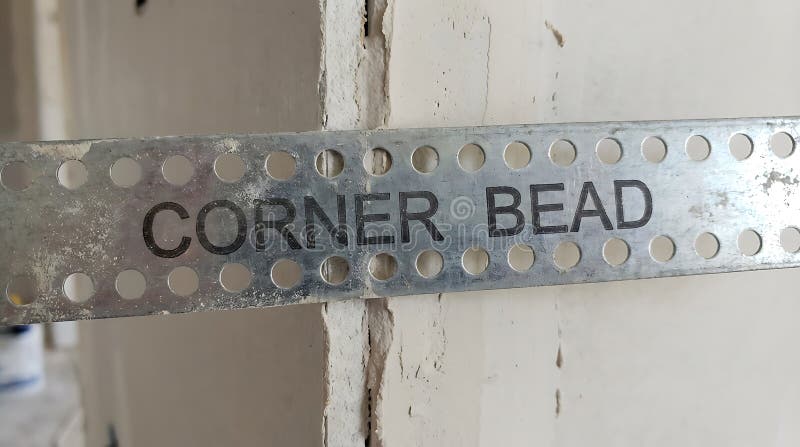 Metal drywall corner bead installed on interior wall royalty free illustration
