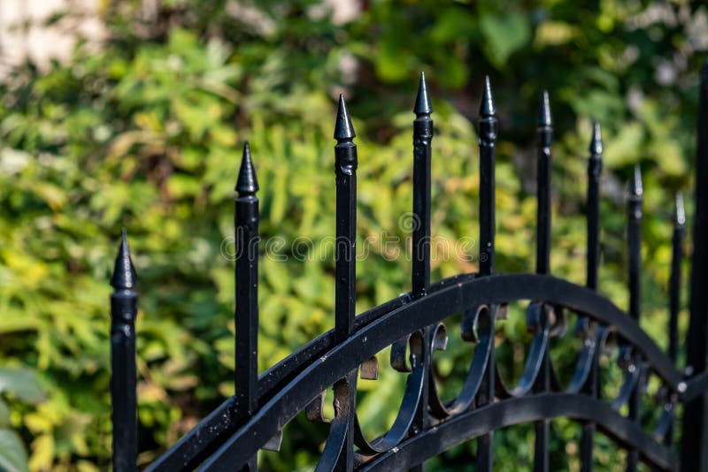 Pointed Wrought Iron Bars Forged To Form a Fence Stock Photo - Image of ...