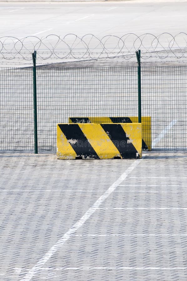 Metal fence and Restricted Area Sign