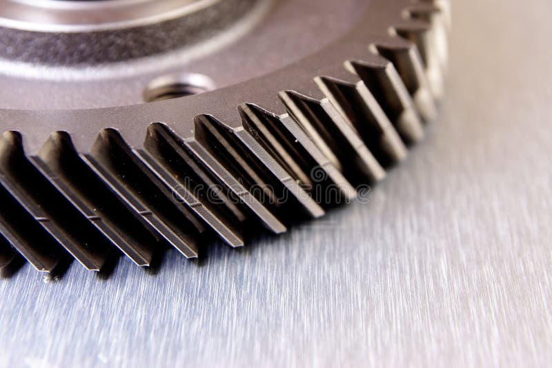 Metal gear on metal surface. Power tech stock images, royalty-free photos and pictures