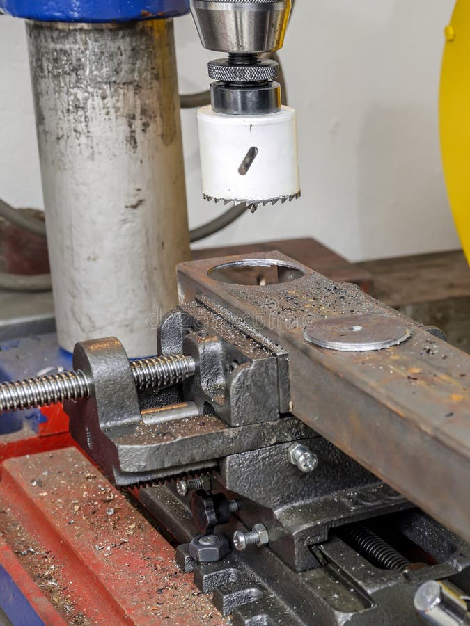 Metal hole cutting stock image. Image of improvement 128367647
