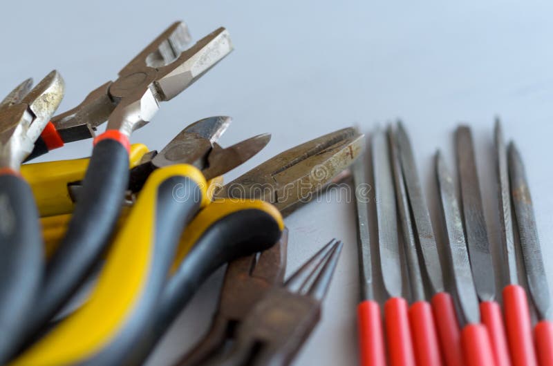 Metal jewelry making tools on the table. Creative craft concept stock images Metal jewelry making tools on the table. Creative craft concept stock images