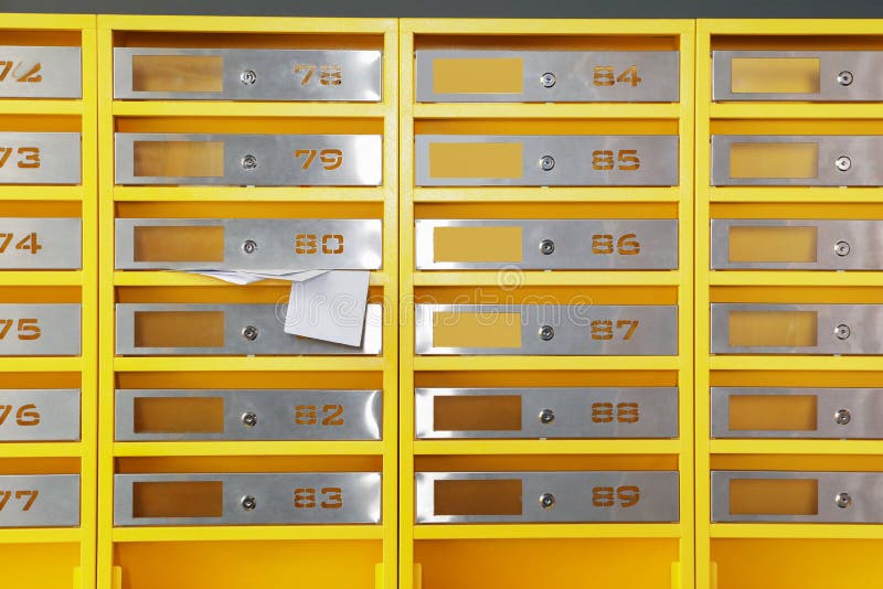 Metal Mailboxes with Receipts from Post Office Indoors Stock Photo