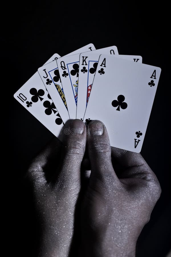 Metal men s hands with playing cards
