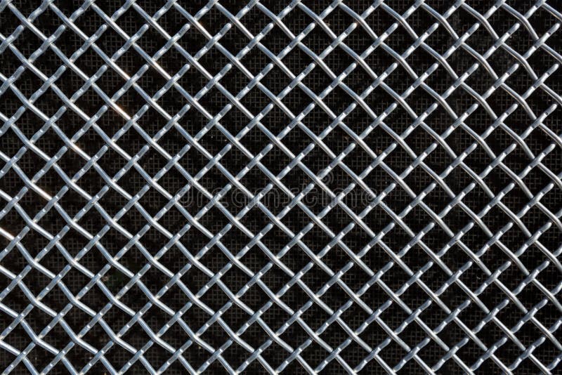 Metal mesh or aluminum grid on black background