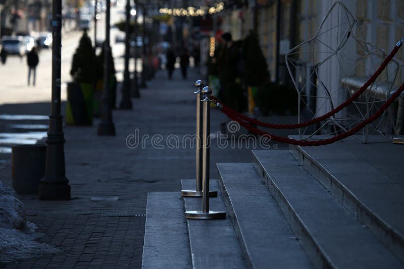 Metal posts on granite steps royalty free stock photo