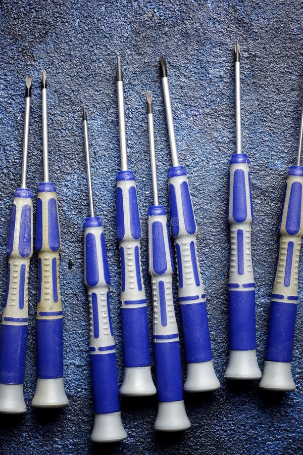 Metal Precision Screwdriver Group on a Blue Table Stock Image Image of maintenance, repair
