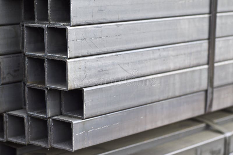 Metal profile pipe of rectangular cross section in packs at the warehouse of metal products stock photo