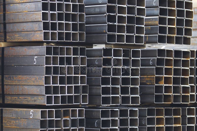 Metal profile pipe of rectangular cross section in packs at the warehouse of metal products stock photos