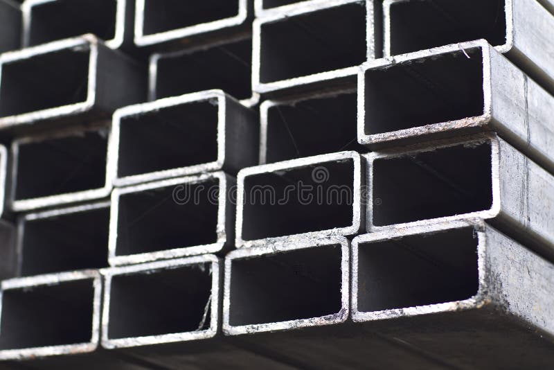 Metal profile pipe of rectangular cross section in packs at the warehouse of metal products stock photo