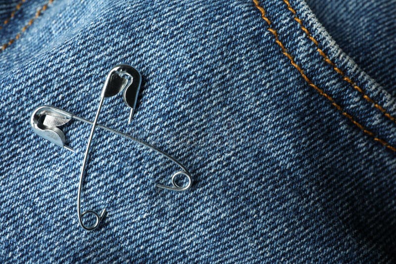 Metal Safety Pins on Denim Fabric, Closeup Stock Photo - Image of ...