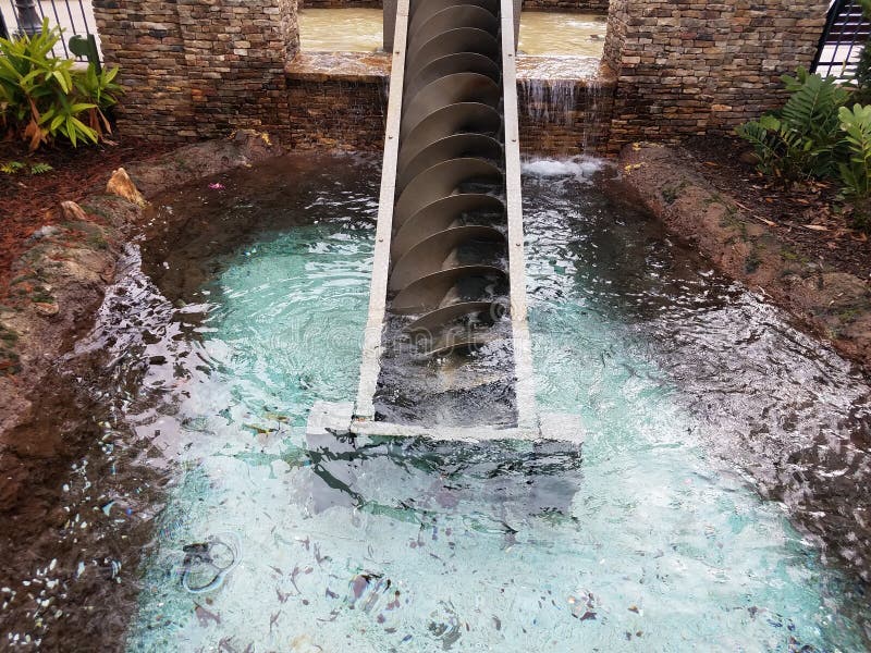 Metal Spiral Water Elevator with Pond Stock Image Image of invention