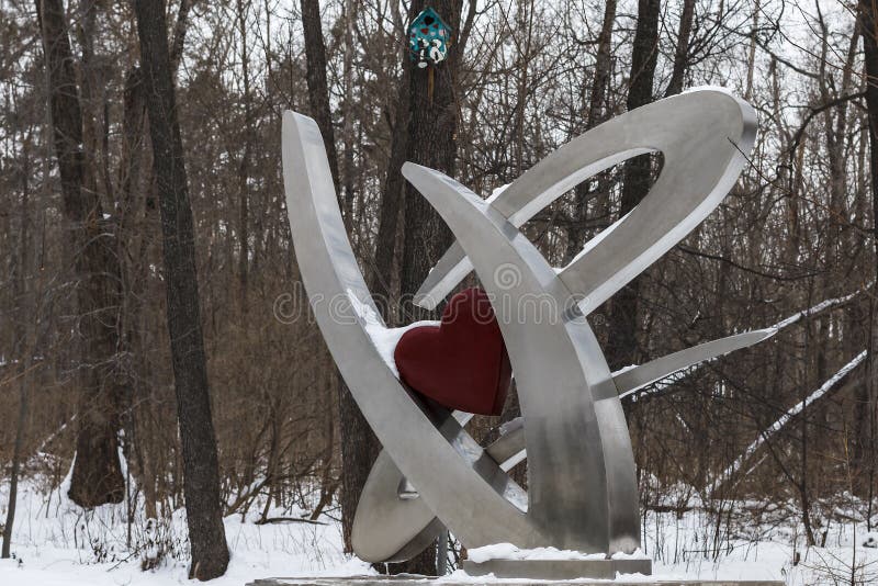 Metal sculpture in the winter wood