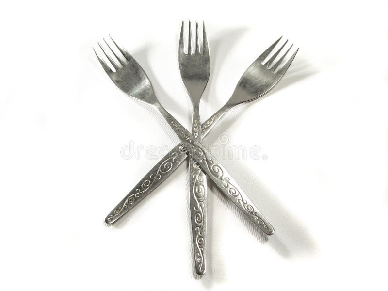 Metal silver forks isolated on white