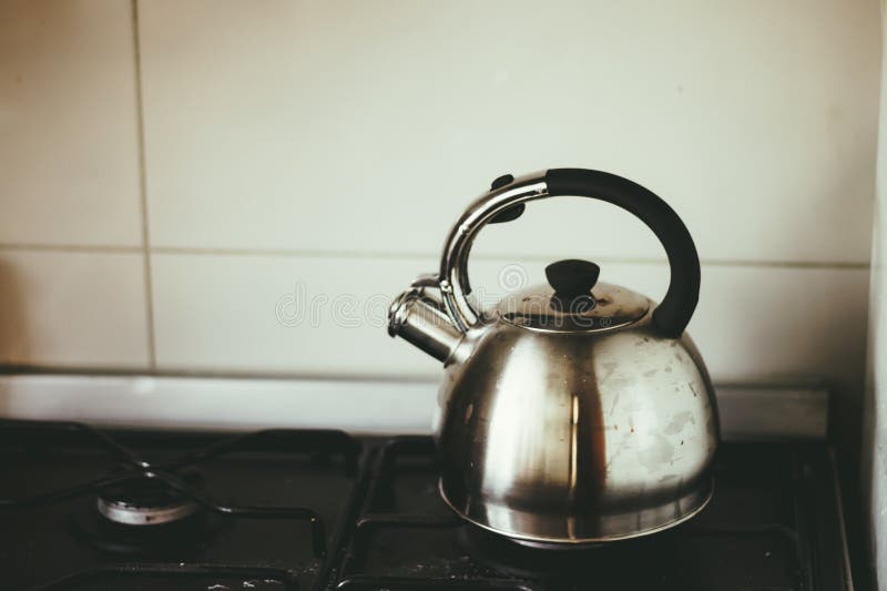 A Metal Silver Teapot on a Gas Stove in the Kitchen Stock Image Image