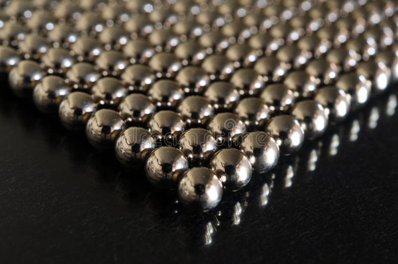 Metal spheres closeup stock image. Image of attraction 41916389