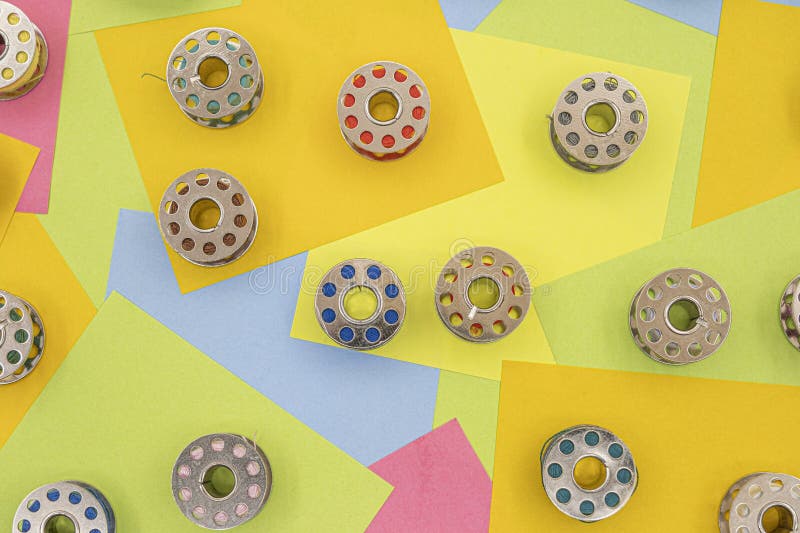 Metal Spools with Multicolored Thread for Sewing Machine on a Table