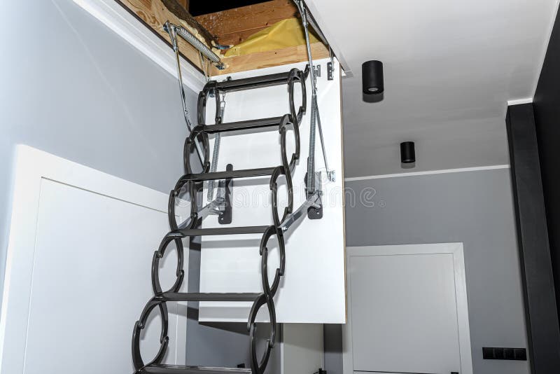 Metal Stairs Hidden in the Ceiling To the Attic with an Opening Hatch and  Folding Stairs in the Corridor, Modern Look. Stock Photo - Image of steel,  corridor: 229797032