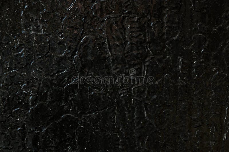 The Metal Surface is Painted with Black Oil Paint. Stock Image