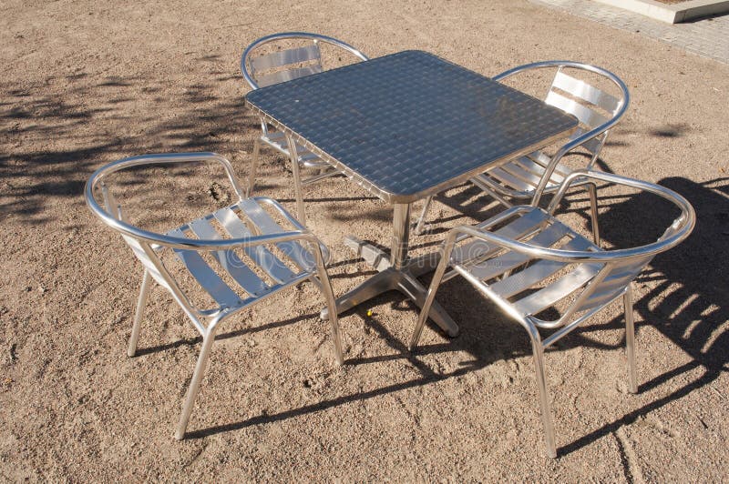 Metal Table and Chairs stock image. Image of outside 48920445
