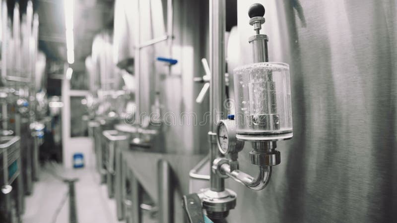 Metal tanks with beer at the brewery