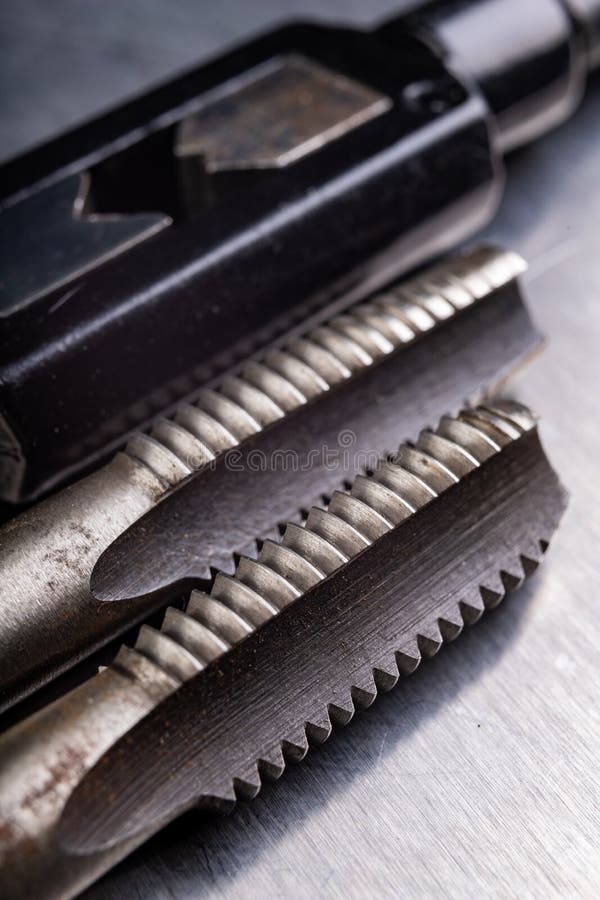 Metal thread cutting tools. Tool steel accessories for locksmiths royalty free stock photo