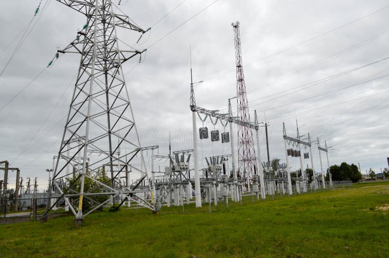 Metal transmission line with the components of the electric network, the system of power equipment for the transmission royalty free stock photo Metal transmission line with the components of the electric network, the system of power equipment for the transmission royalty free stock photo