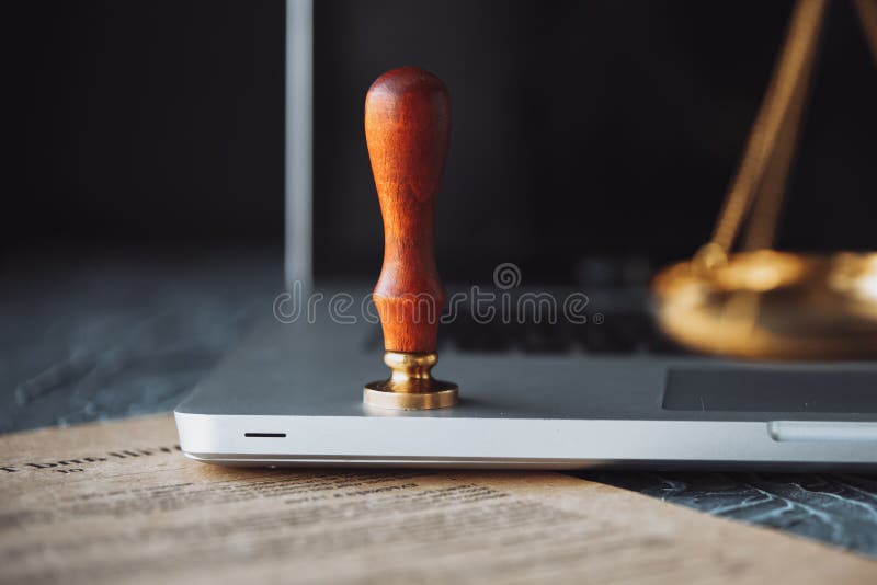 Metal wax notary public stamper on old document. Law stock image Metal wax notary public stamper on old document. Law stock image