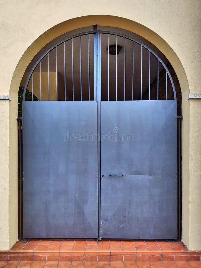 Metal Yard Door with Arch and Grating. Stock Image Image of double