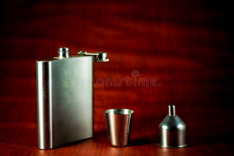 Metallic container for liquid, alcohol, whiskey and cognac. Old classic pocket vessel royalty free stock images Metallic container for liquid, alcohol, whiskey and cognac. Old classic pocket vessel royalty free stock images