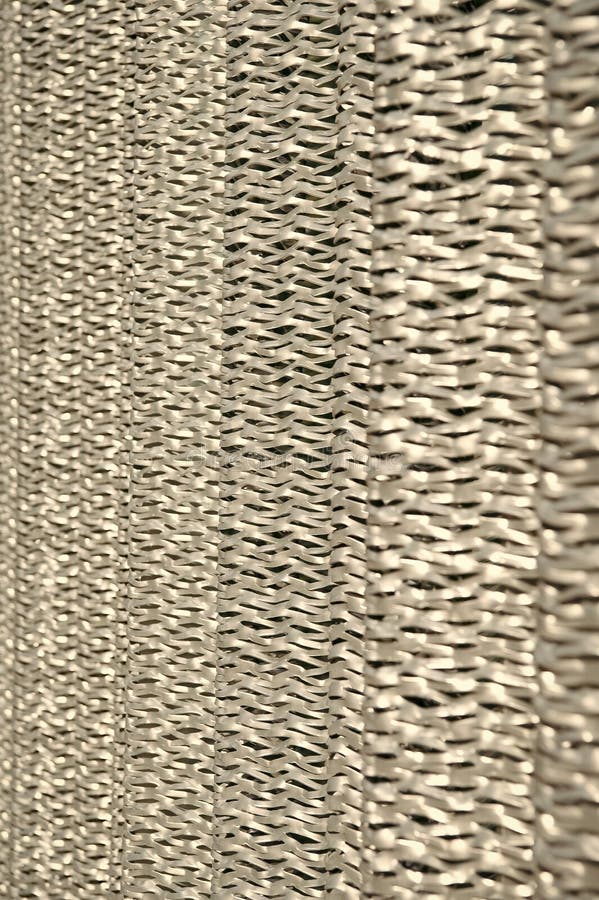 Metallic netting. Protective material. Metal recycling. Metallic screen. Industrial concept. Iron producing. Sharp. Metallic netting, Protective material. Metal