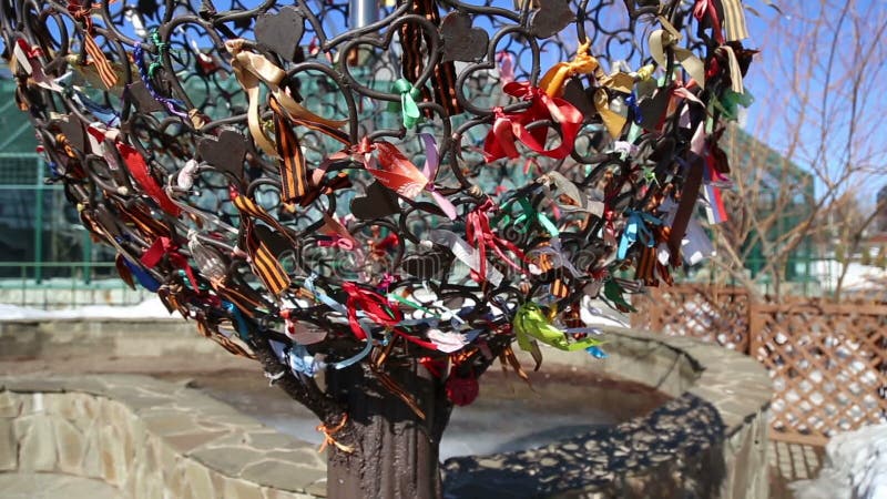 Metallic tree decorated with ribbons